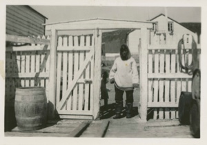 Image: Eskimo [Inuk] man standing in gateway